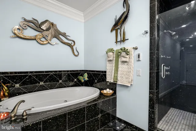 a kitchen with stainless steel appliances a refrigerator and cabinets