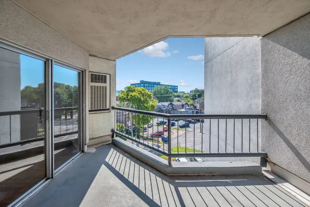 a view of balcony with wooden floor