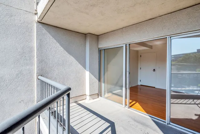 a bedroom with a bed and large window