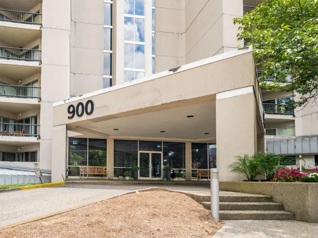 a front view of a building with sitting area