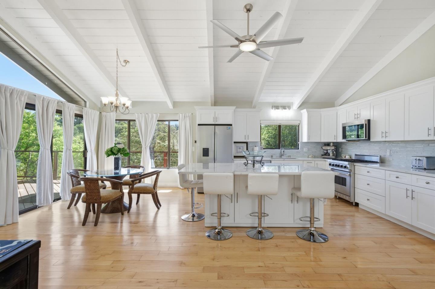 701 Day Valley Road Aptos, CA 95003 - Photo 8 of 43 a view of a kitchen with dining table and chairs