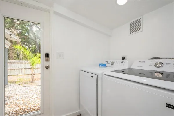 a utility room with dryer and washer
