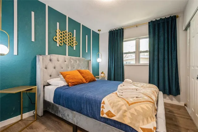 a bedroom with a bed and window