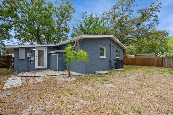 a house with a tree in front of it