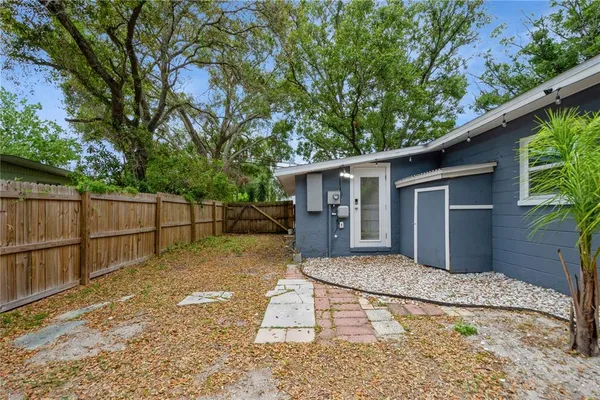 a house view with a backyard space