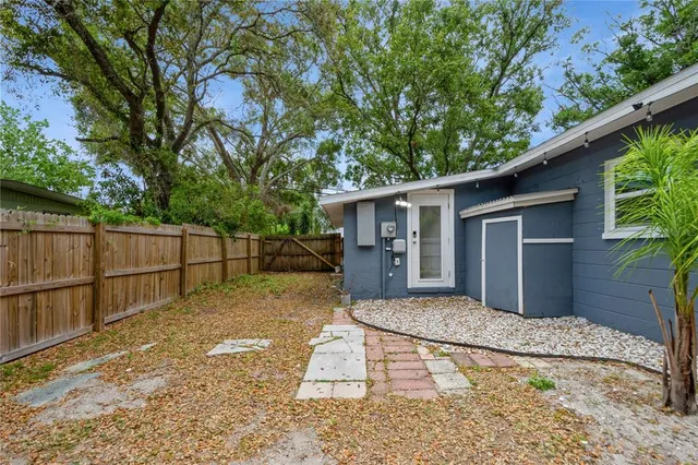 a house view with a backyard space
