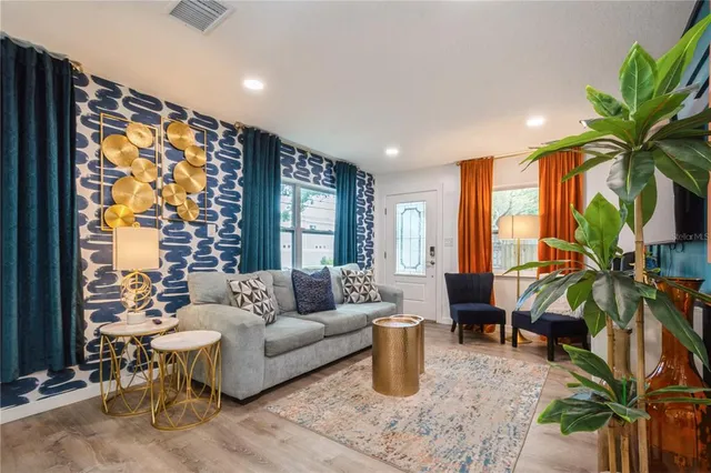 a living room with furniture and a large window