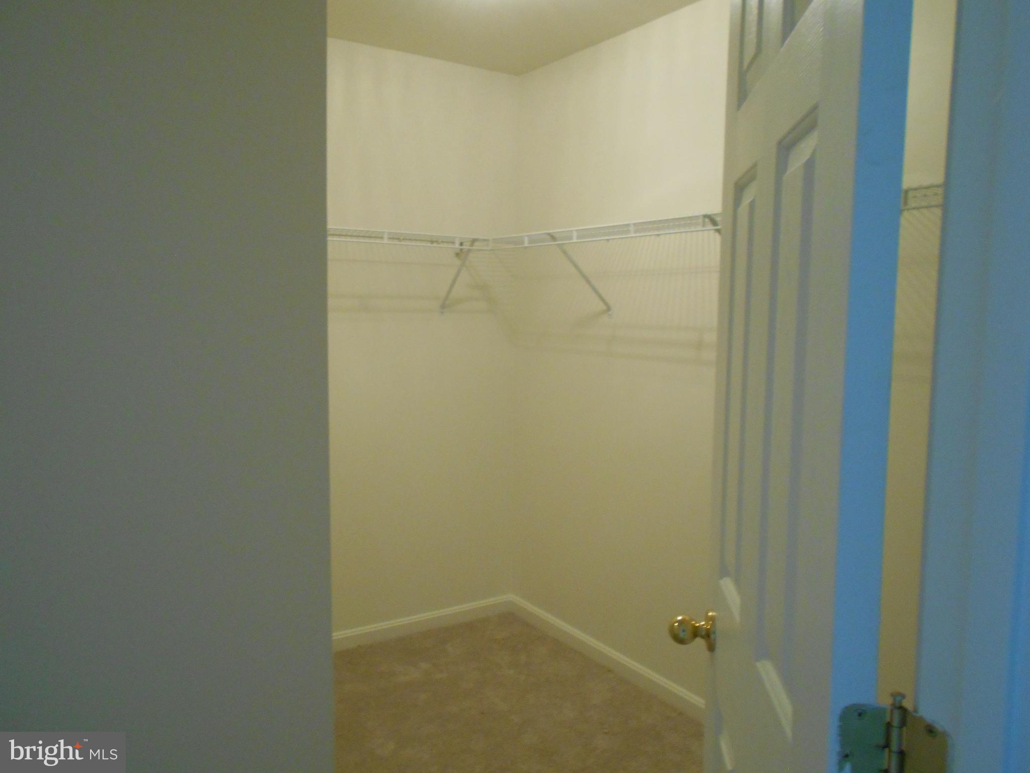 306 Appleby School Road Cambridge, MD 21613 - Photo 17 of 24 His walk-in closet