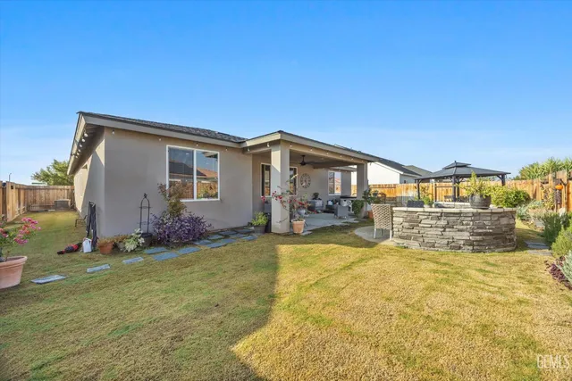 an aerial view of a house with a garden