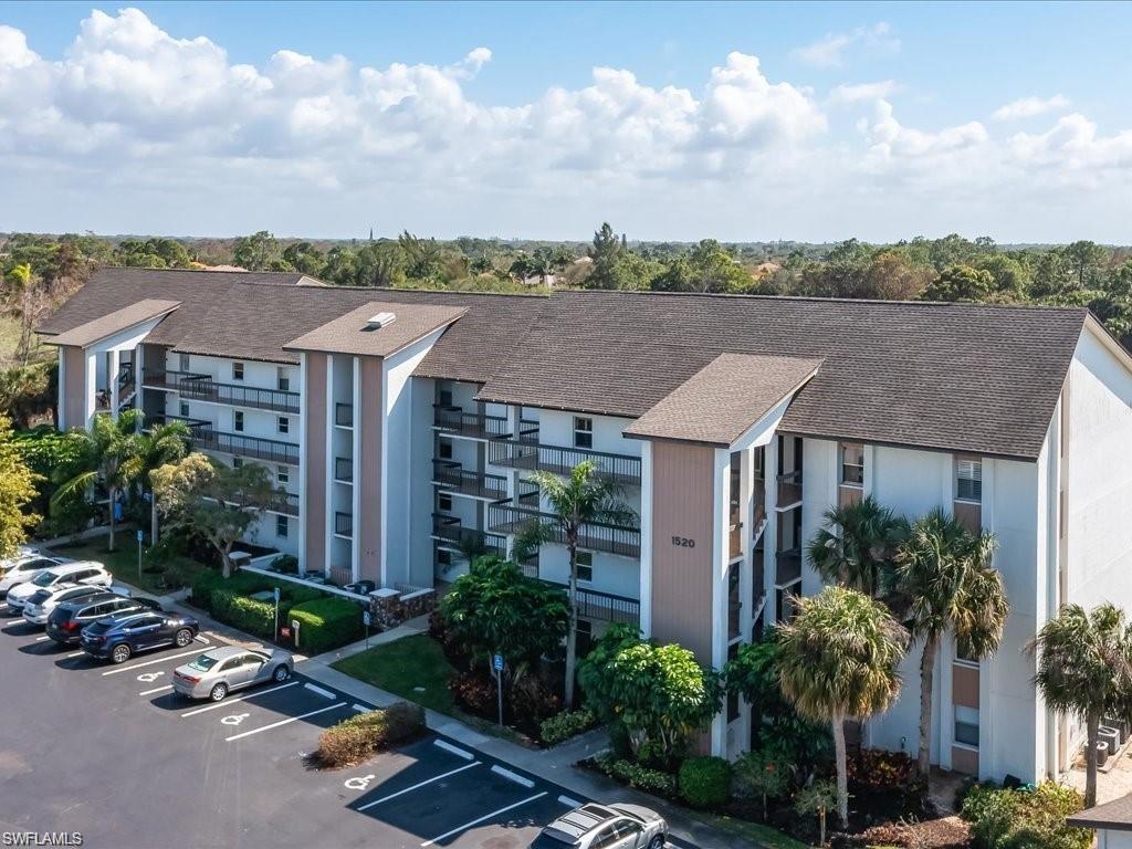 1520 Imperial Golf Course Boulevard, Unit 211 Naples, FL 34110 - Photo 2 of 24