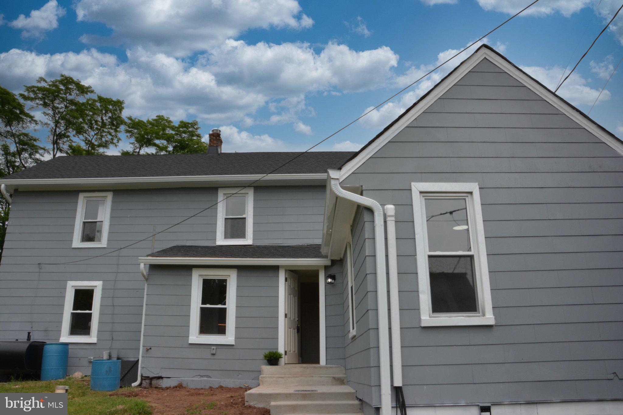 1006 Circle Drive Keymar, MD 21757 - Photo 42 of 45 Charming gray home under a blue sky.