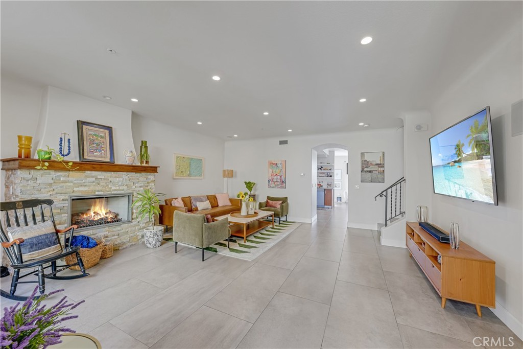 308 5th Street Huntington Beach, CA 92648 - Photo 20 of 41 a living room with furniture and a fireplace
