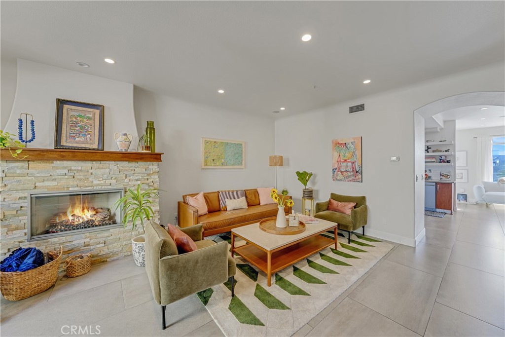 308 5th Street Huntington Beach, CA 92648 - Photo 22 of 41 a living room with furniture and a fireplace