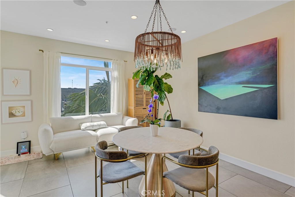 308 5th Street Huntington Beach, CA 92648 - Photo 24 of 41 a living room with furniture and a flat screen tv