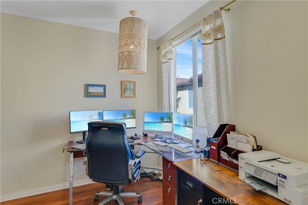 308 5th Street Huntington Beach, CA 92648 - Photo 31 of 41 a view of a workspace with furniture and a window