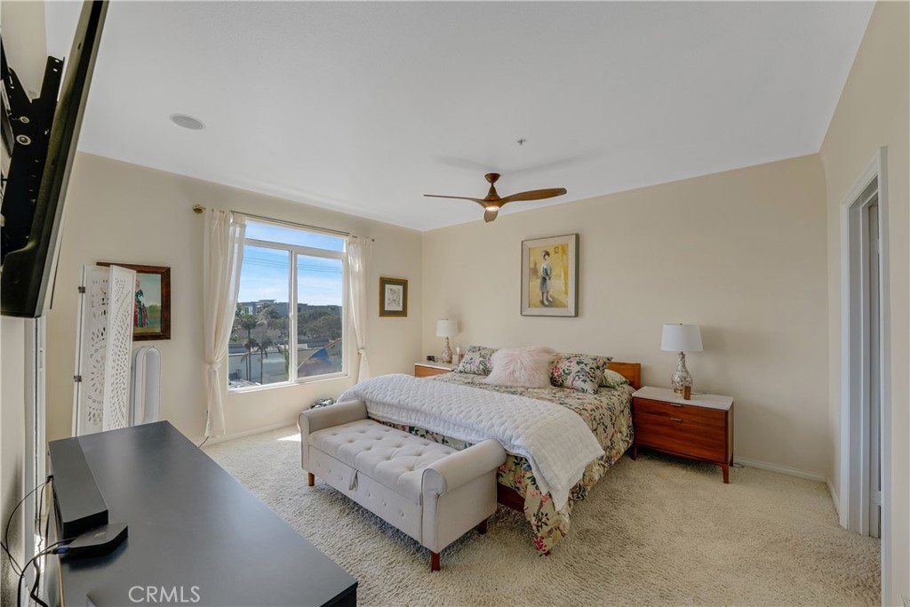 308 5th Street Huntington Beach, CA 92648 - Photo 32 of 41 a bedroom with a bed and large window