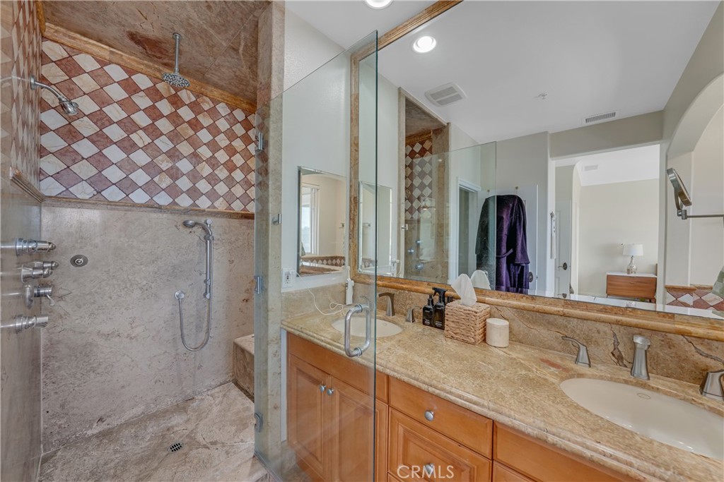 308 5th Street Huntington Beach, CA 92648 - Photo 36 of 41 a bathroom with a double vanity sink mirror and double