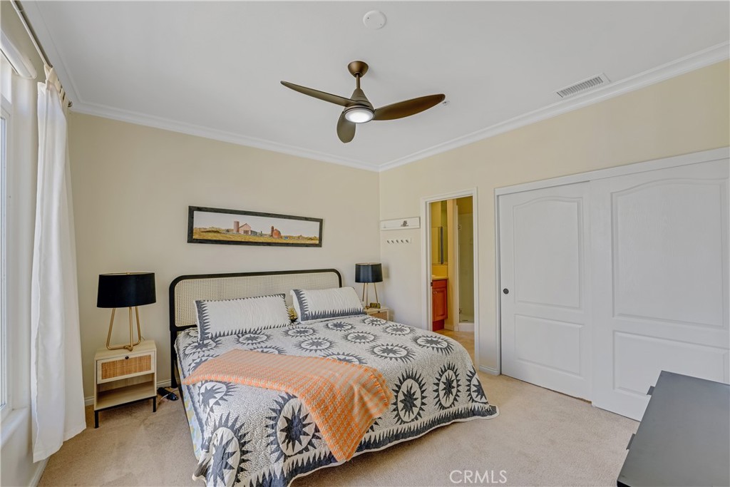 308 5th Street Huntington Beach, CA 92648 - Photo 37 of 41 a bedroom with a bed and a painting on the wall