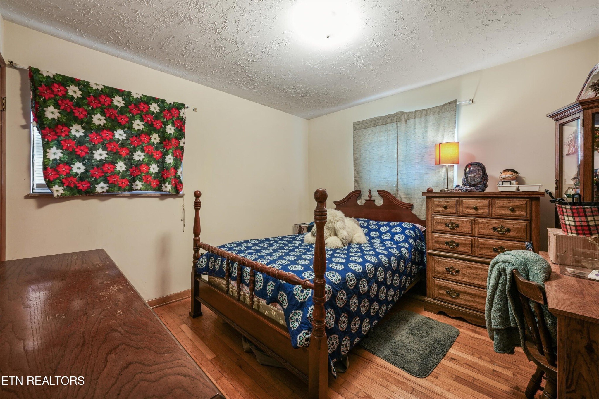 960 Talbott-Kansas Road Talbott, TN 37877 - Photo 20 of 43 a bedroom with a bed and wooden floor