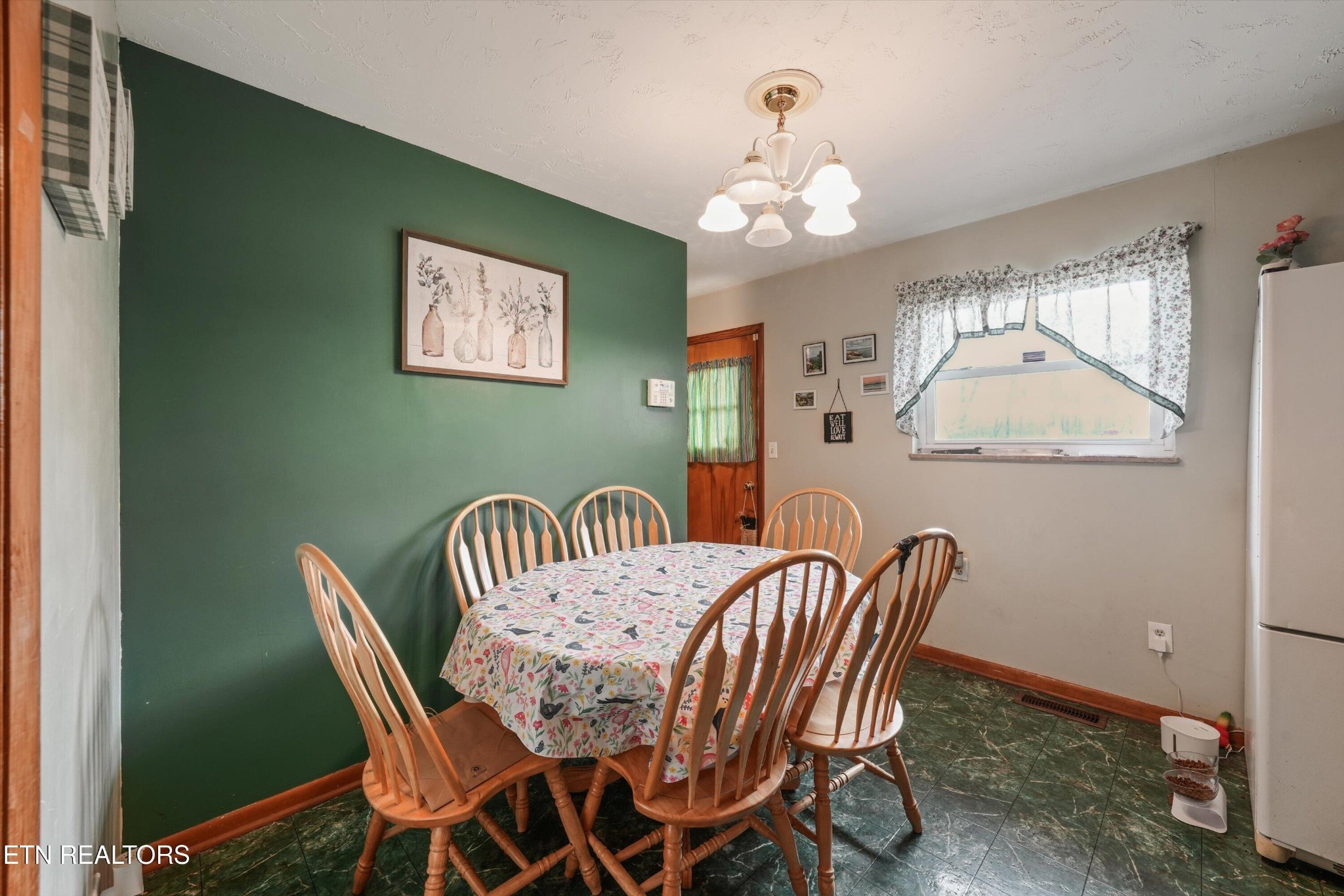 960 Talbott-Kansas Road Talbott, TN 37877 - Photo 10 of 43 a view of a dining room with furniture and a chandelier