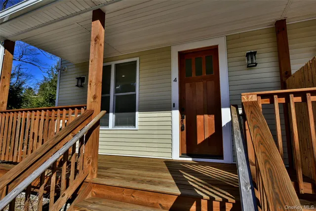 a view of balcony with wooden floor