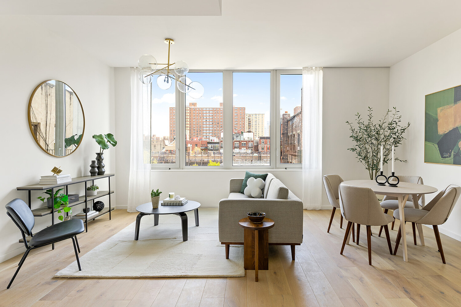 a living room with furniture a table and a large mirror