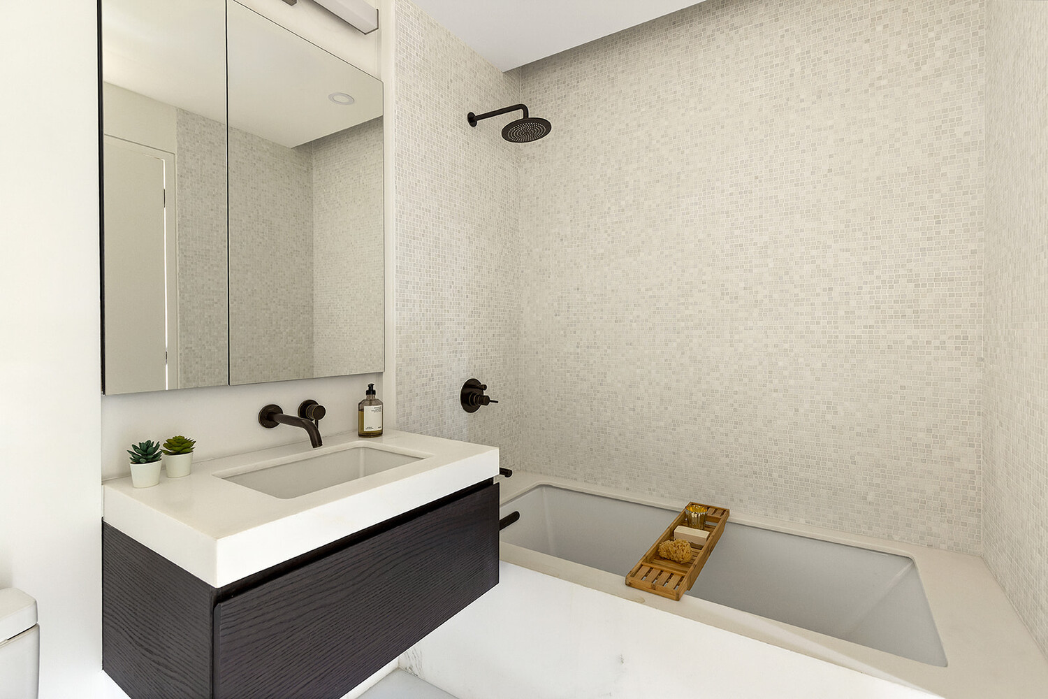 66 Clinton Street, Unit 5B Manhattan, NY 10002 - Photo 4 of 14 a bathroom with a sink and a mirror