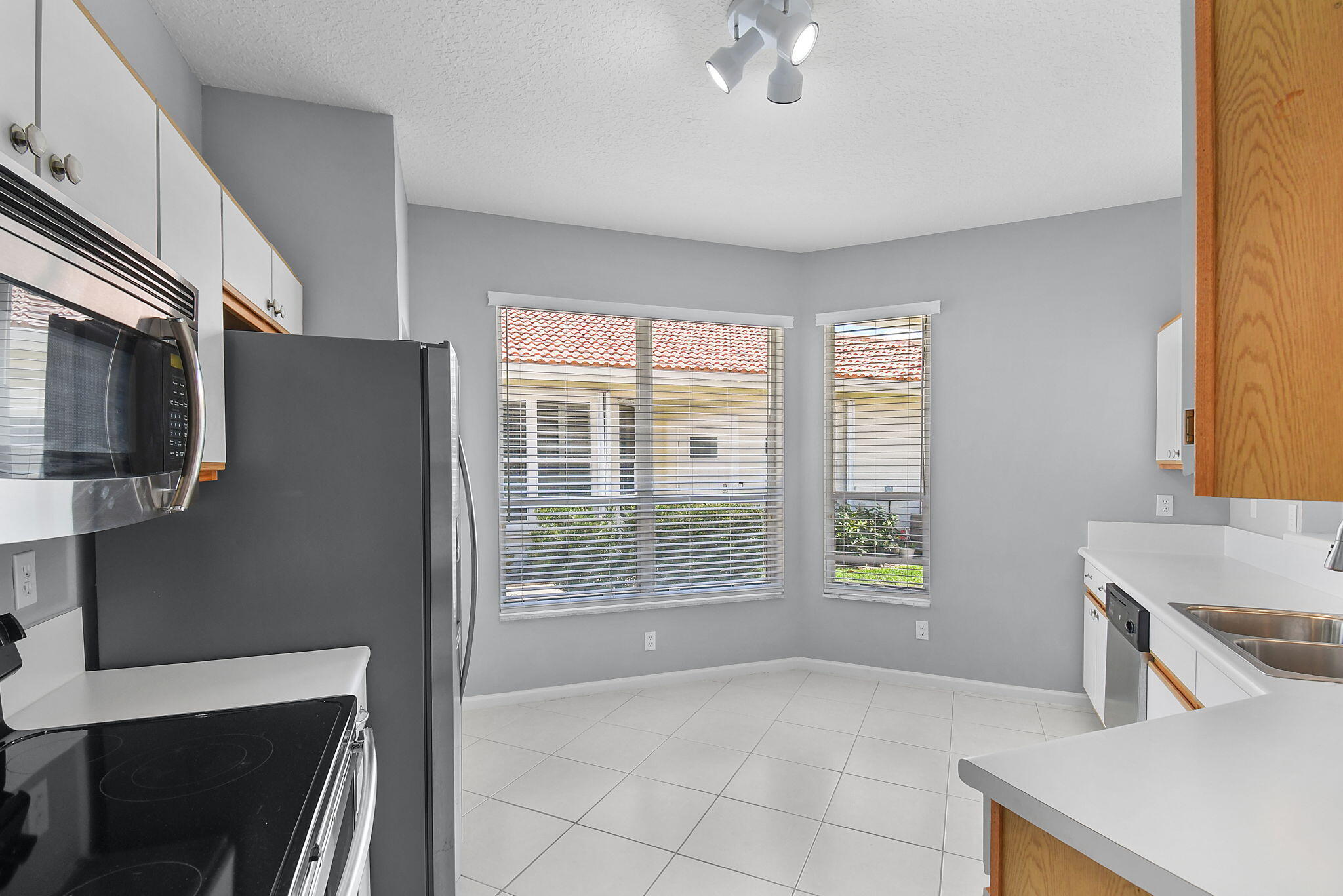 6785 Southeast Warwick Lane Stuart, FL 34997 - Photo 12 of 62 a view of livingroom with furniture and windows