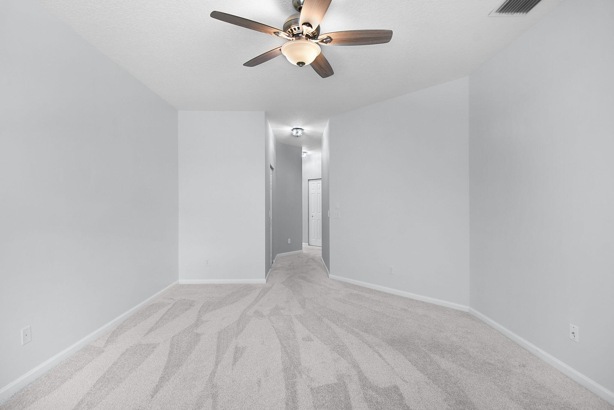 6785 Southeast Warwick Lane Stuart, FL 34997 - Photo 25 of 62 a view of an empty room