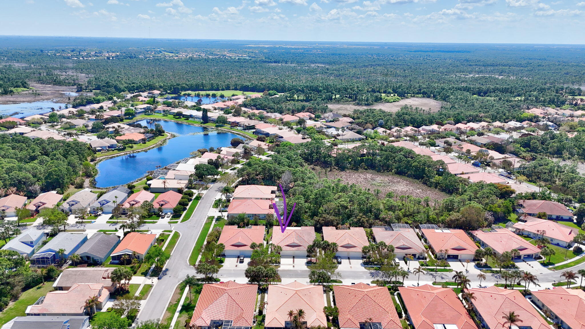 6785 Southeast Warwick Lane Stuart, FL 34997 - Photo 37 of 62 an aerial view of residential houses with outdoor space