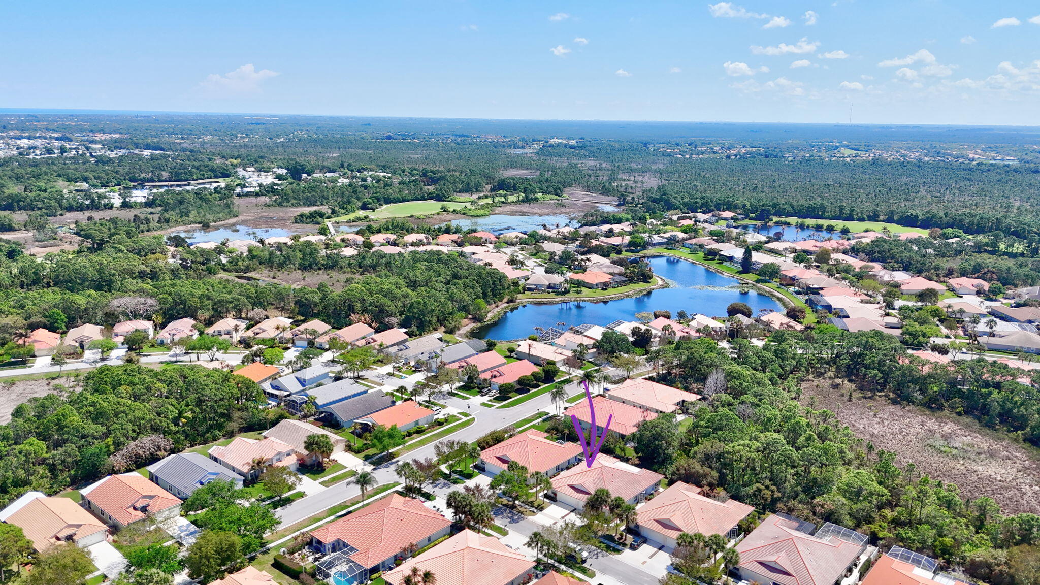 6785 Southeast Warwick Lane Stuart, FL 34997 - Photo 39 of 62 an aerial view of residential houses with outdoor space