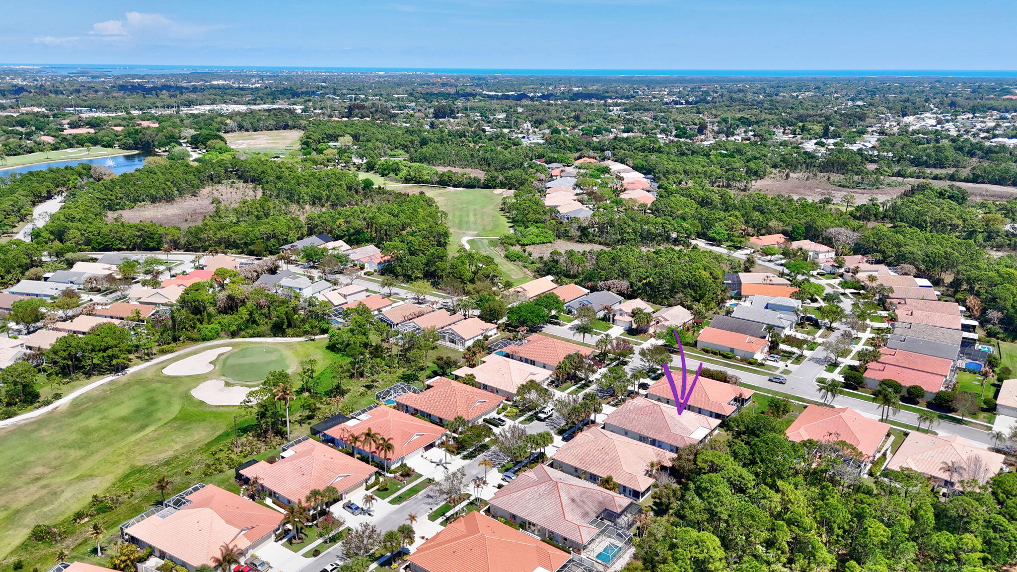 6785 Southeast Warwick Lane Stuart, FL 34997 - Photo 41 of 62 an aerial view of residential houses with outdoor space