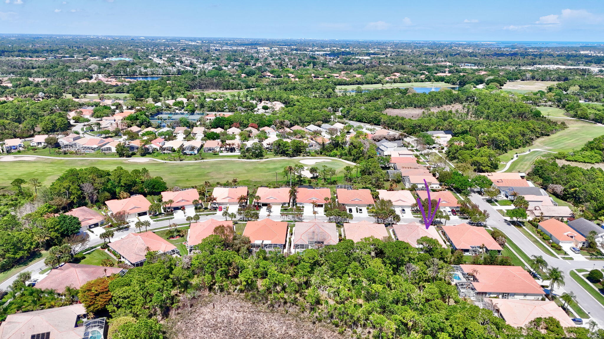 6785 Southeast Warwick Lane Stuart, FL 34997 - Photo 42 of 62 an aerial view of residential houses with outdoor space and trees