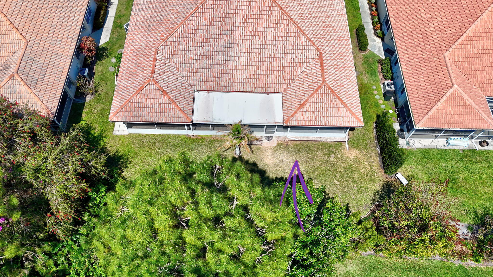 6785 Southeast Warwick Lane Stuart, FL 34997 - Photo 49 of 62 a backyard of a house with lots of green space