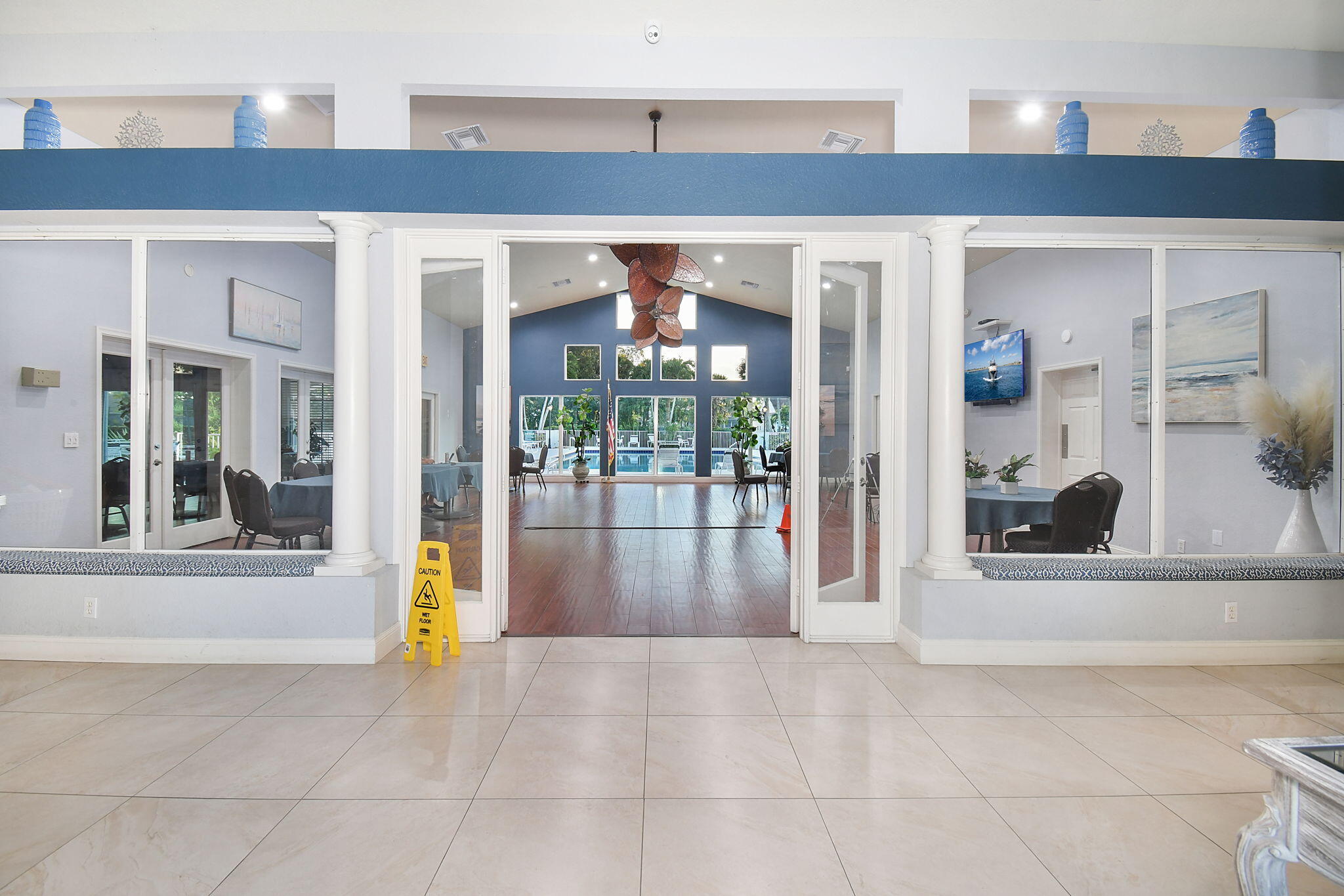 6785 Southeast Warwick Lane Stuart, FL 34997 - Photo 54 of 62 a view of a building with a glass door