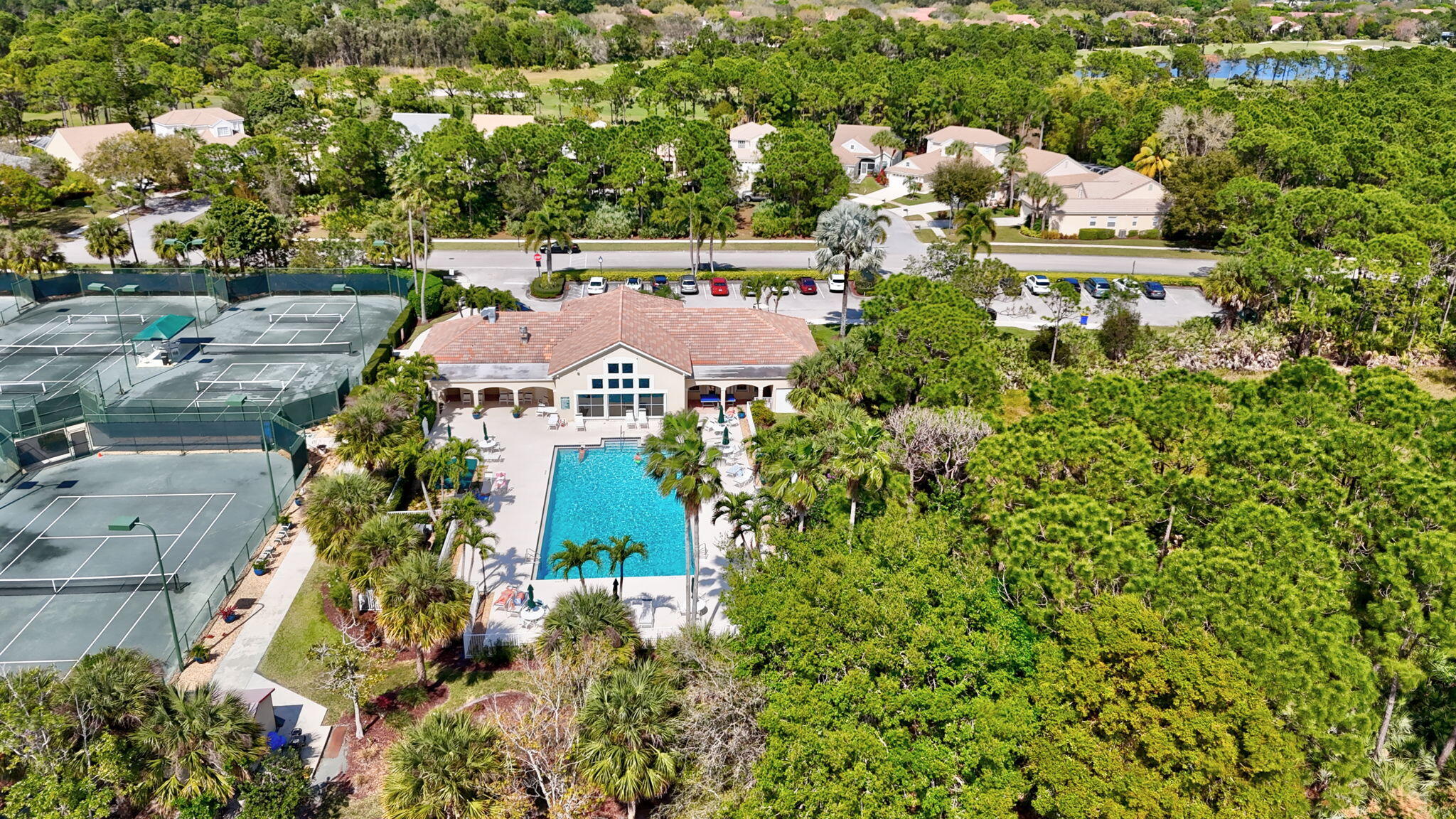 6785 Southeast Warwick Lane Stuart, FL 34997 - Photo 58 of 62 an aerial view of a house with a yard and lake view