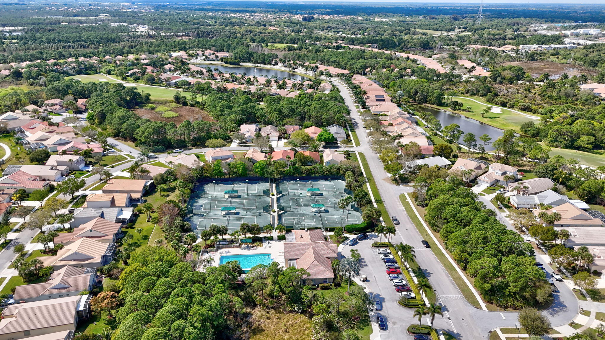 6785 Southeast Warwick Lane Stuart, FL 34997 - Photo 59 of 62 an aerial view of residential houses with outdoor space