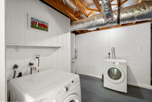 a utility room with sink dryer and washer