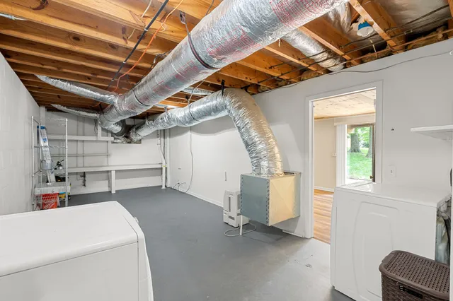a view of storage and utility room with stairs