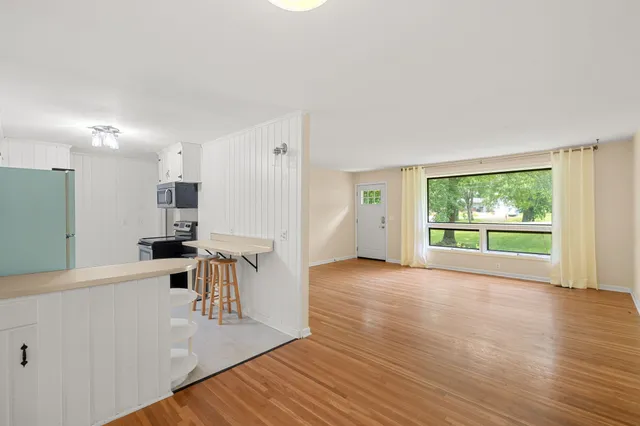 a view of a kitchen with furniture and a window