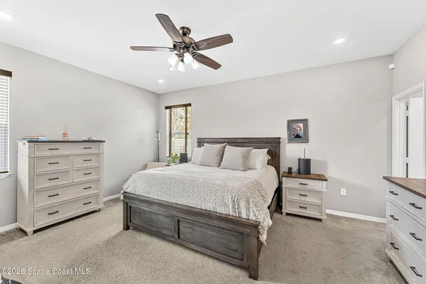 a bedroom with a bed and a cabinets