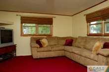 16 Finley Road Edison, NJ 08817 - Photo 4 of 6 a living room with furniture and a flat screen tv
