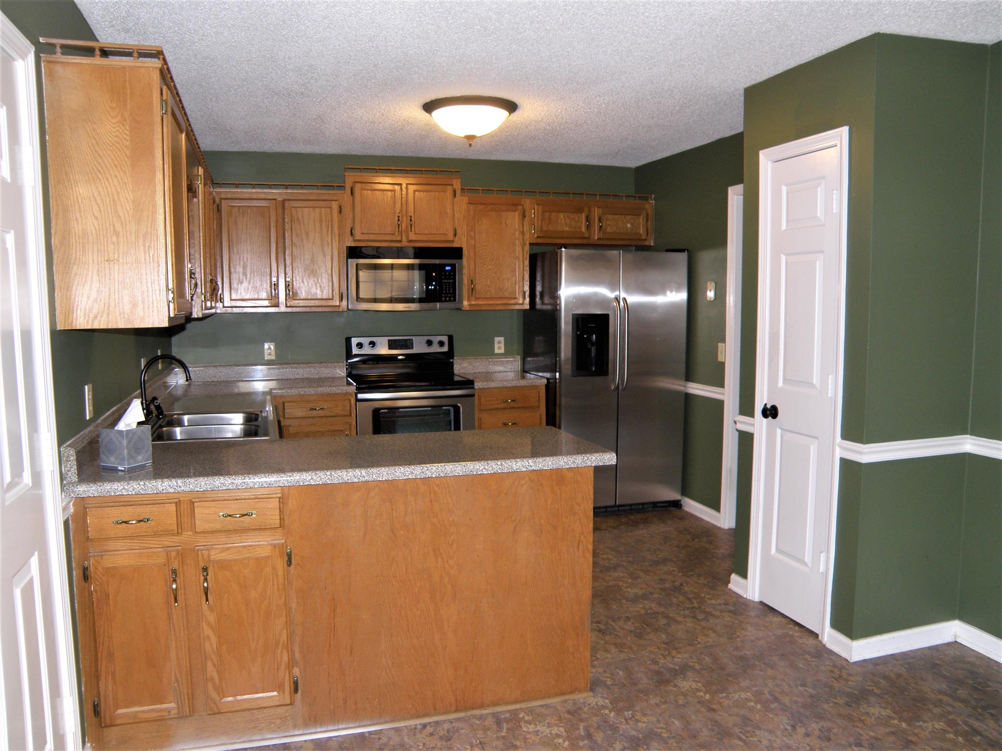 3517 Country Way Road Antioch, TN 37013 - Photo 7 of 15 a kitchen with stainless steel appliances granite countertop a refrigerator a stove and a sink