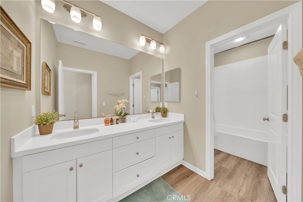 75 Gardenstone Path Irvine, CA 92620 - Photo 48 of 65 a bathroom with a double vanity sink and a mirror