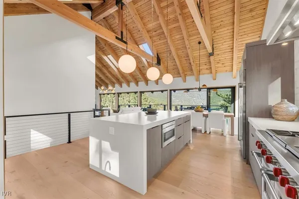 a kitchen with stainless steel appliances stove top oven and cabinets
