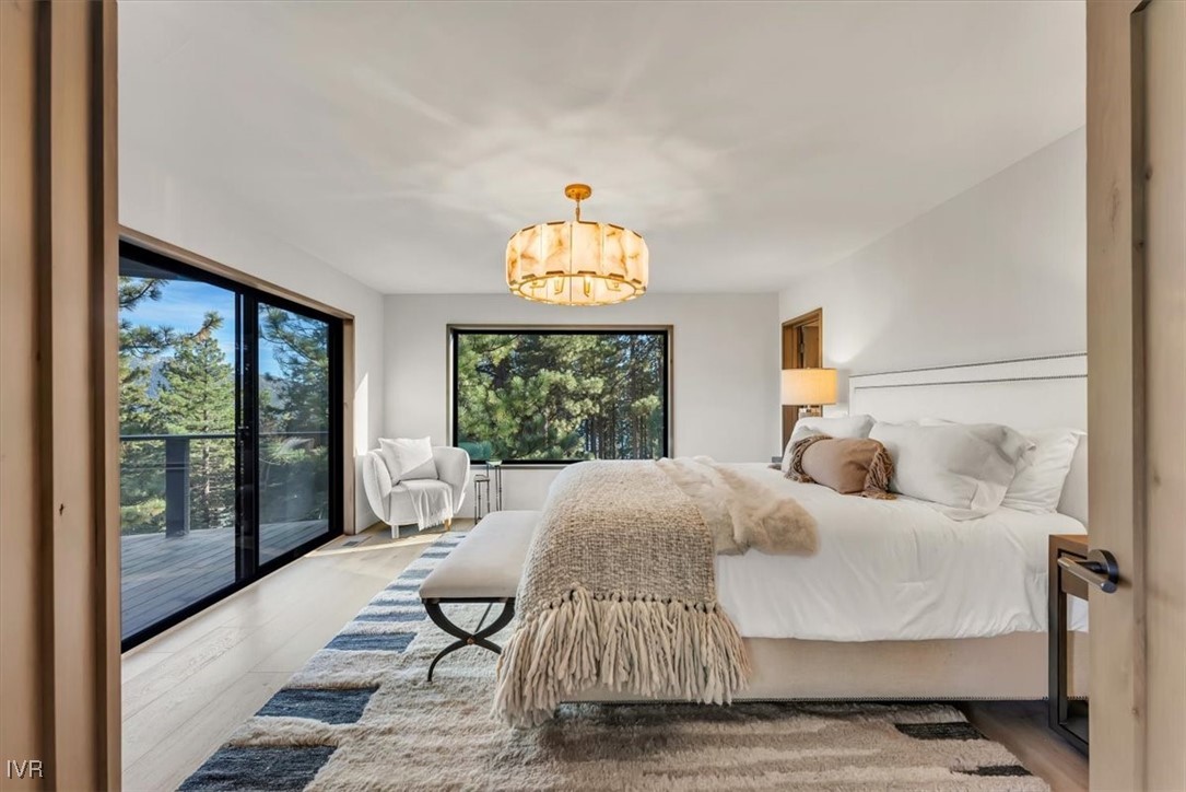 877 Tyner Way Incline Village, NV 89451 - Photo 21 of 43 a bedroom with a bed and a large window