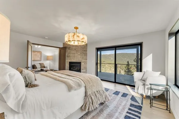 a spacious bedroom with a bed and a table
