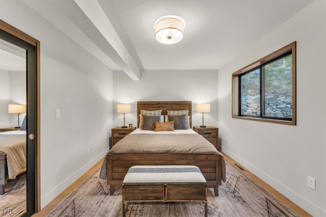 877 Tyner Way Incline Village, NV 89451 - Photo 27 of 43 a bedroom with a bed and a painting on the wall