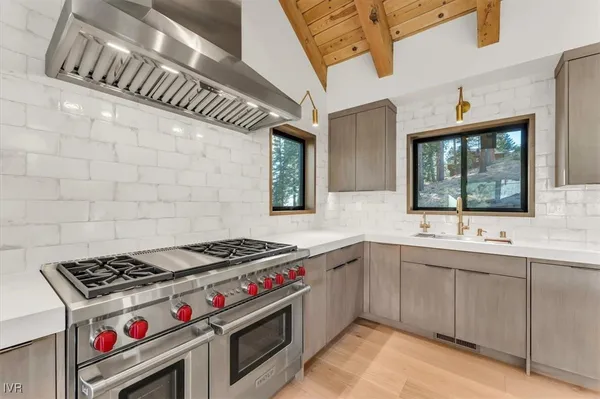 a kitchen that has a sink and a stove