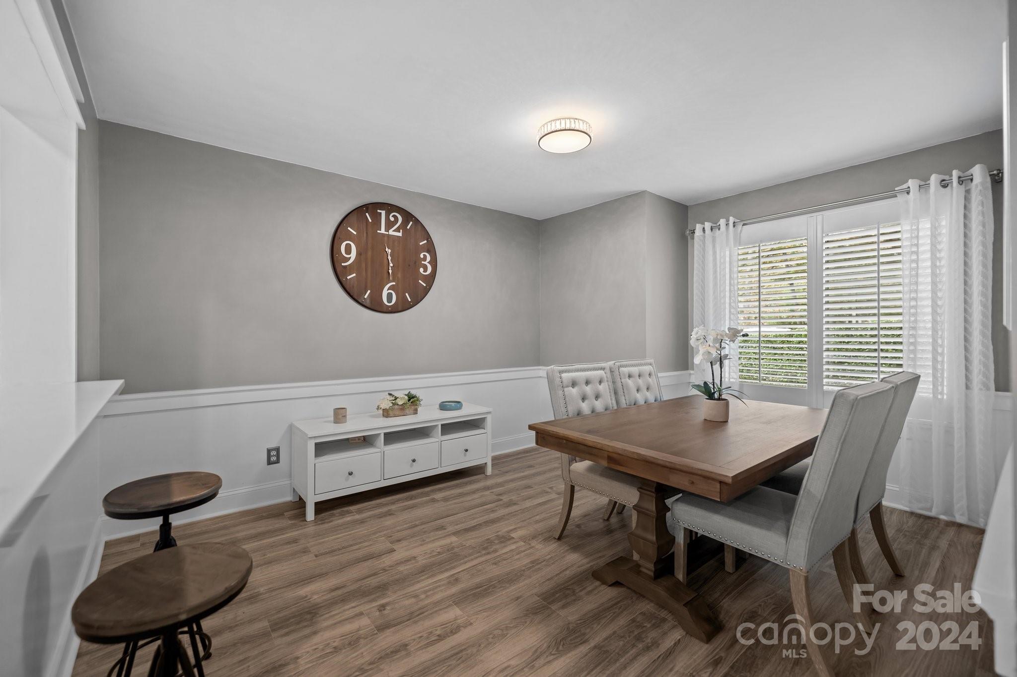 55 Ridgeport Road Lake Wylie, SC 29710 - Photo 11 of 45 a view of a dining room with furniture and wooden floor